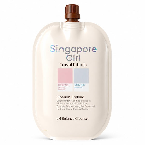 Singapore Girl Travel Rituals Siberian Dryland pH Balance Cleanser in a large cream-colored squeeze pouch with a brown cap, on a white background.