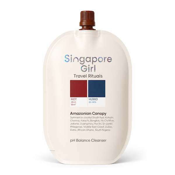 Singapore Girl Travel Rituals Amazonian Canopy pH Balance Cleanser in a flexible, rounded off-white pouch with a brown cap, shown on a white background.