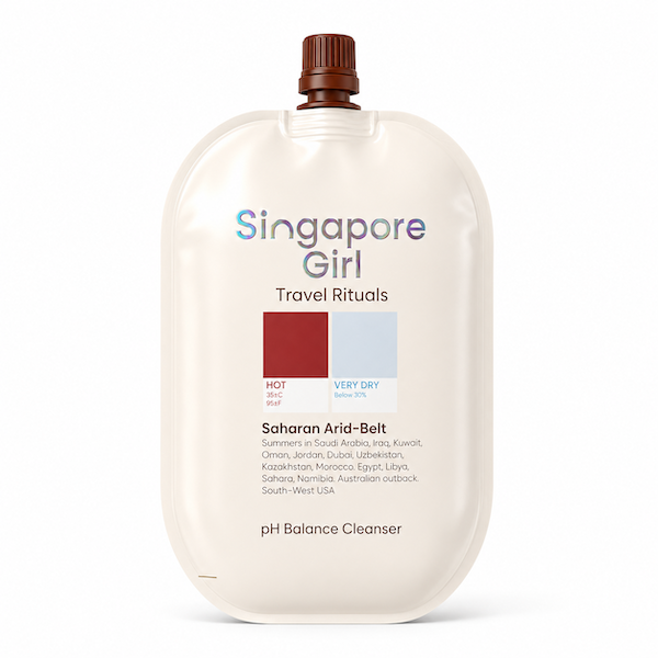 Singapore Girl Travel Rituals Saharon Arid-Belt cleanser in a large cream-colored squeeze pouch with a brown cap, shown on a white background.