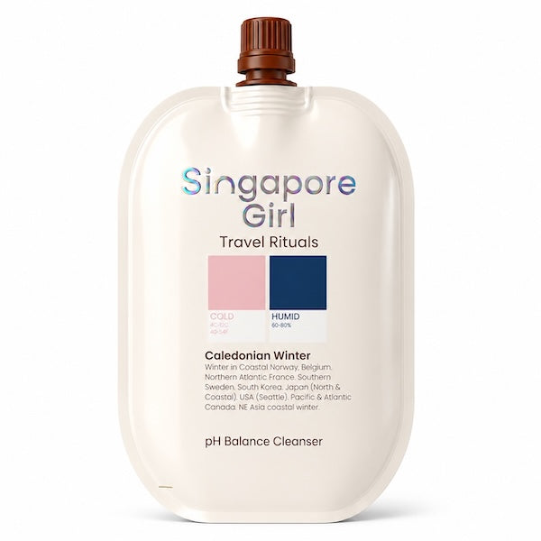 Singapore Girl Travel Rituals pH Balance Cleanser in a cream-colored squeeze pouch with a brown cap, on a white background.