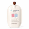 Singapore Girl Travel Rituals Alpine Summer Highland dry travel cleanser in a large cream-colored squeeze bottle with a brown cap, on a white background.