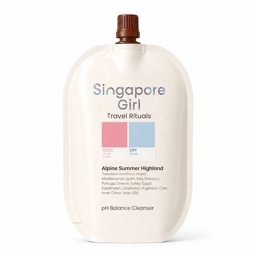 Singapore Girl Travel Rituals Alpine Summer Highland dry travel cleanser in a large cream-colored squeeze bottle with a brown cap, on a white background.