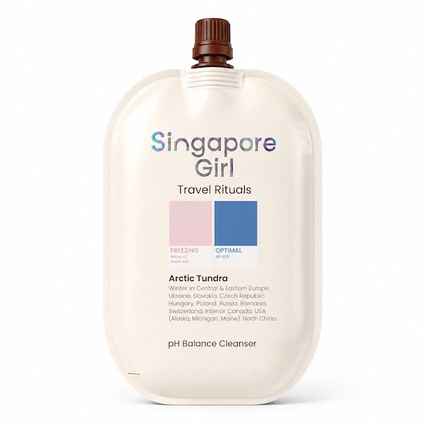 Singapore Girl Travel Rituals Arctic Tundra pH Balance Cleanser in a cream-colored squeeze pouch with a brown cap, shown on a white background.