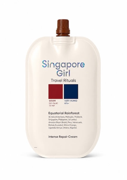 A large, rounded travel cream bottle labeled 'Singapore Girl Travel Rituals' with a brown cap, on a clean white background.