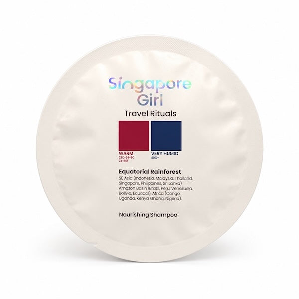 A round, off-white foil packet of Singapore Girl Travel Rituals Equatorial Rainforest Nourishing Shampoo, displayed on a clean white background.