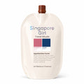 A single-serve refill pouch of Singapore Girl Travel Rituals Appalachian Forest pH Balance Cleanser, featuring a cream-colored body, a brown cap, and a color block label with pink and blue swatches.