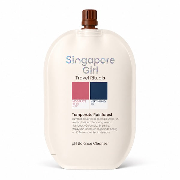 Singapore Girl Travel Rituals Temperate Rainforest pH Balance Cleanser in a cream-colored squeeze bottle with a brown cap, shown on a white background.