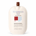 Singapore Girl Travel Rituals Atocama Sun Plateau pH Balance Cleanser in a large cream-colored squeeze bottle with a brown cap, shown on a white background.